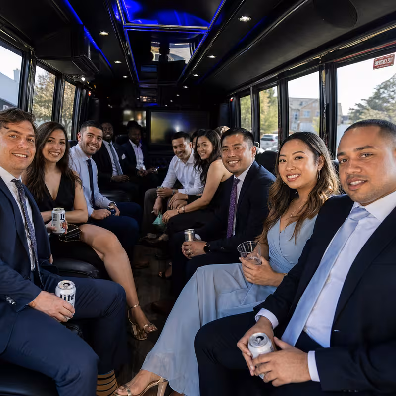 Wedding guests seated inside a Staten Island party bus