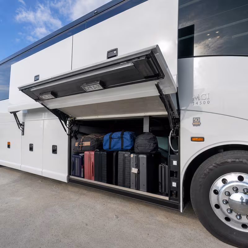 Party bus interior with wraparound leather seating and LED lighting in Staten Island