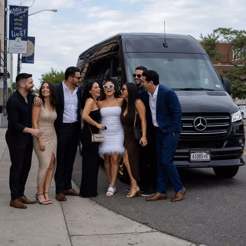 Group boarding a white charter bus for Bachelor & Bachelorette Transportation transportation in Staten Island