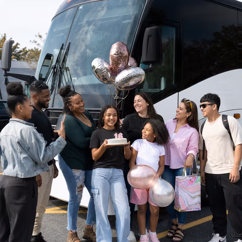 Passengers loading luggage while boarding an Staten Island group shuttle