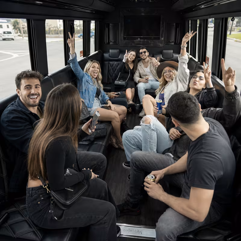 Group boarding a white charter bus for Concert Transportation transportation in Staten Island