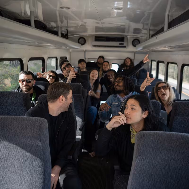 Party bus interior with wraparound leather seating and LED lighting in Staten Island