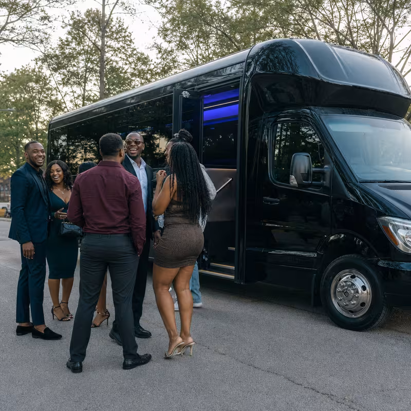 Passengers loading luggage while boarding an Staten Island group shuttle