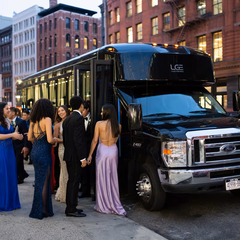 Passengers loading luggage while boarding an Staten Island group shuttle