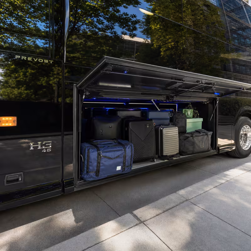 Party bus interior with wraparound leather seating and LED lighting in Staten Island