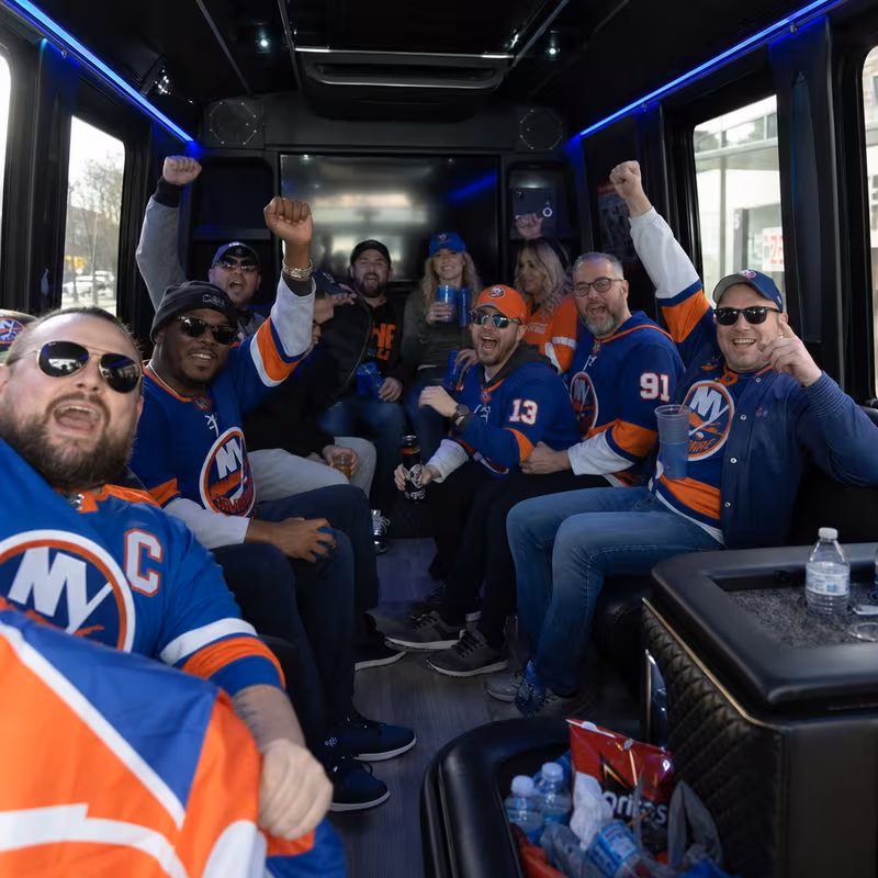 Group boarding a white charter bus for Sporting Event Transportation transportation in Staten Island